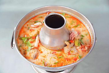 Hot and sour Tom Yum milky soup with seafood